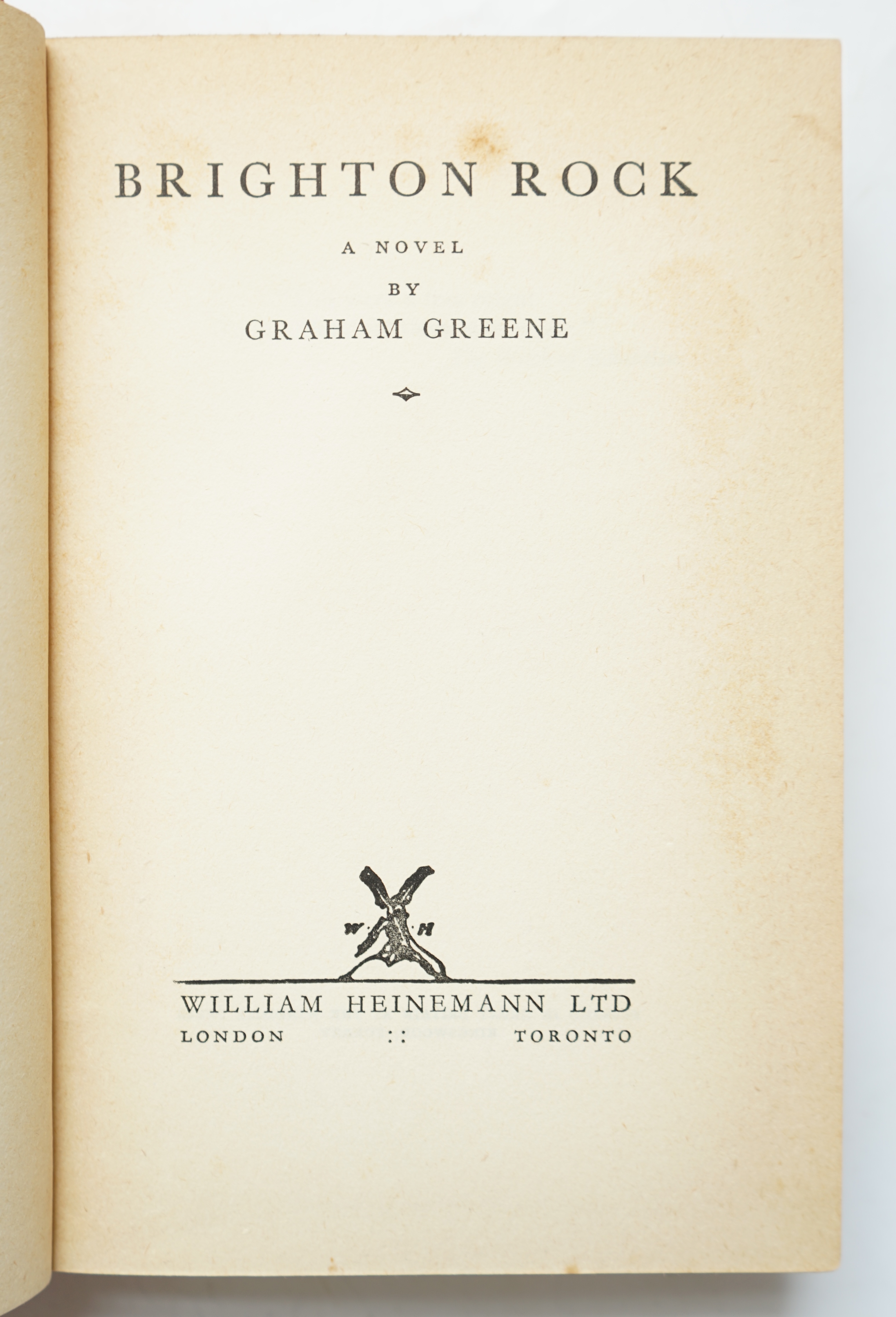 Greene, Graham - Brighton Rock, 1st English edition, 8vo, original red cloth, with some toning to margins and endpapers, (as often), closed tear to margin of pp, 343 and 359, William Heinemann Ltd., London, 1938.